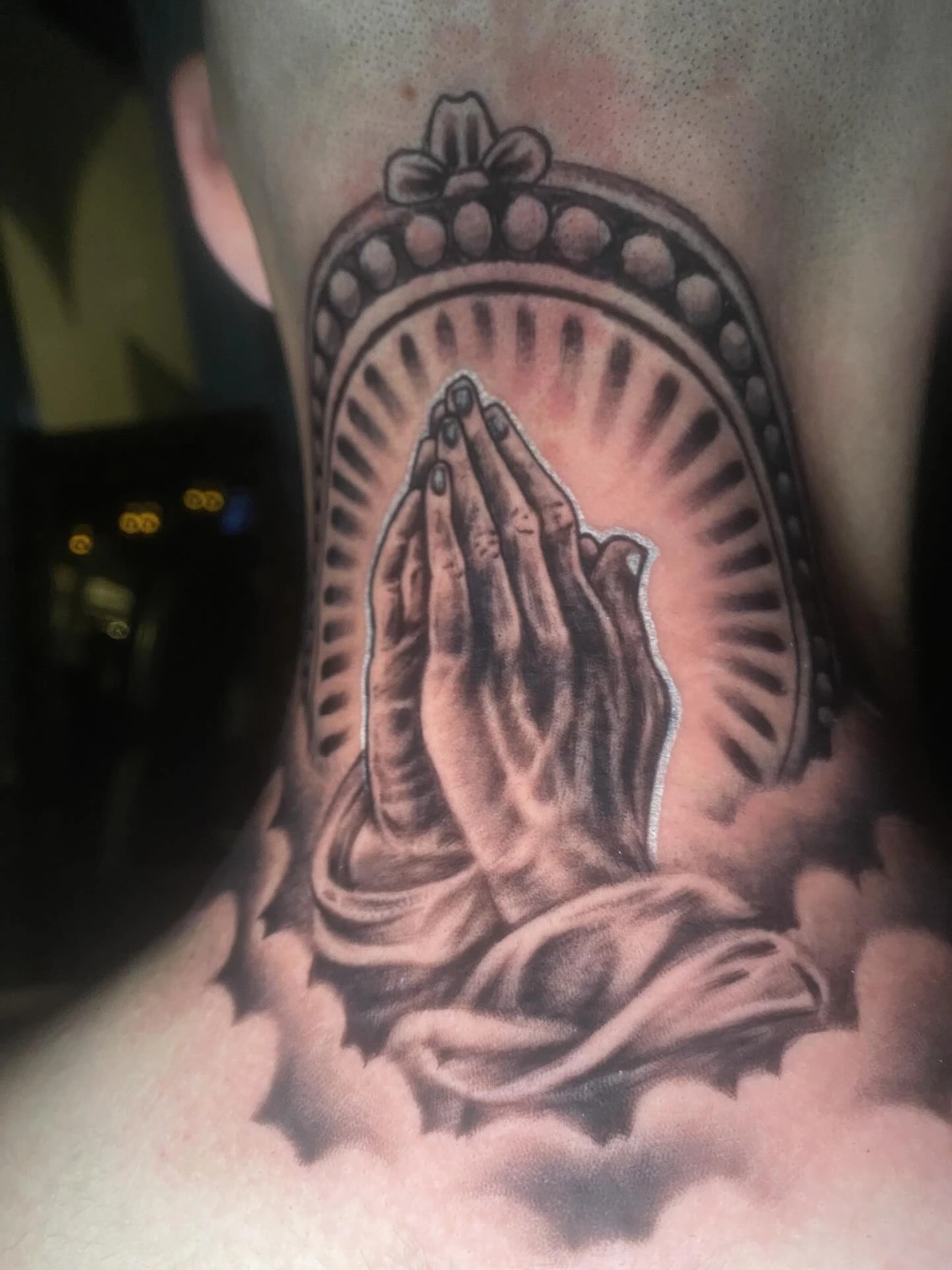 Praying hands with rosary, beaded halo arch and cloud border
