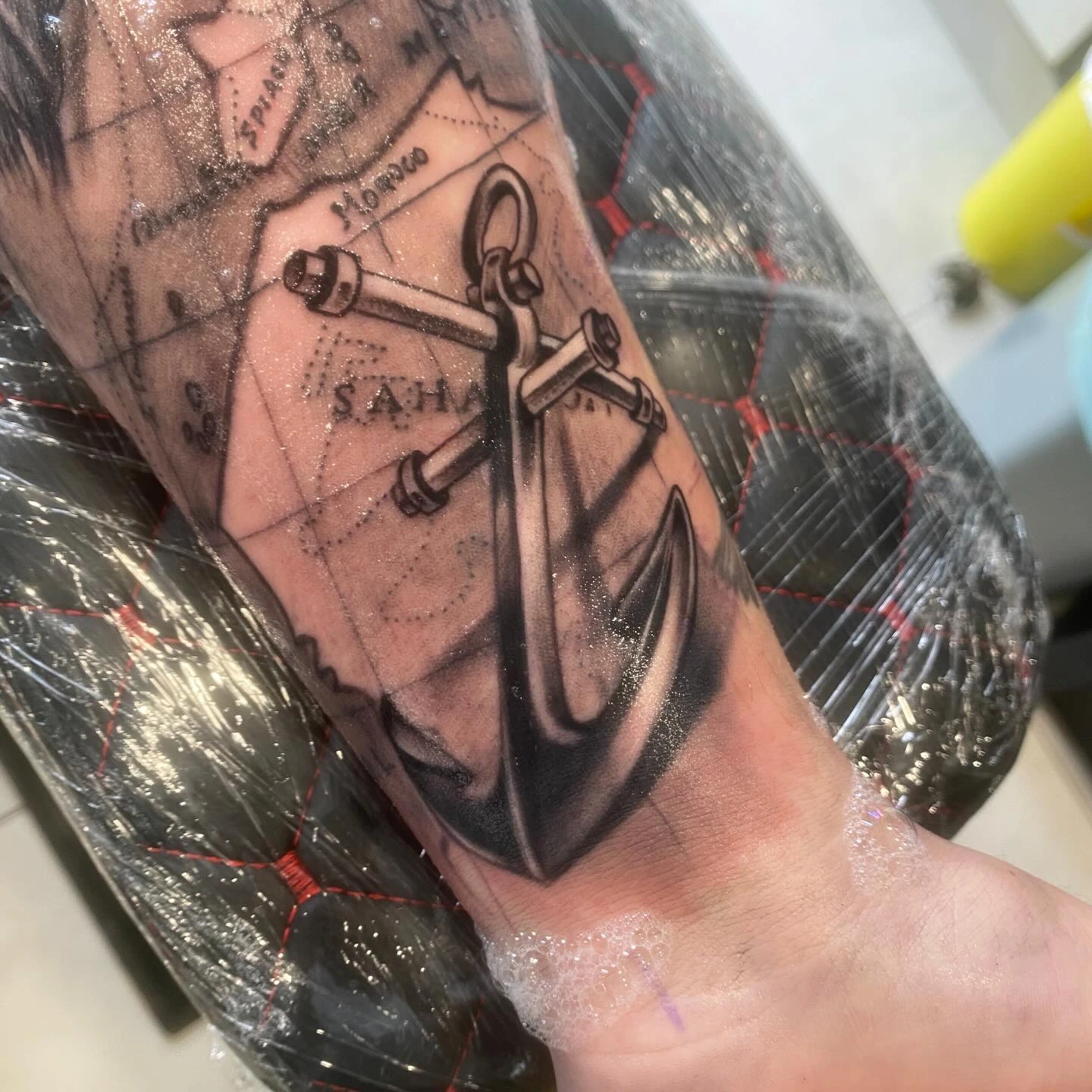 Anchor over Sahara/Spain map background, B&G realism