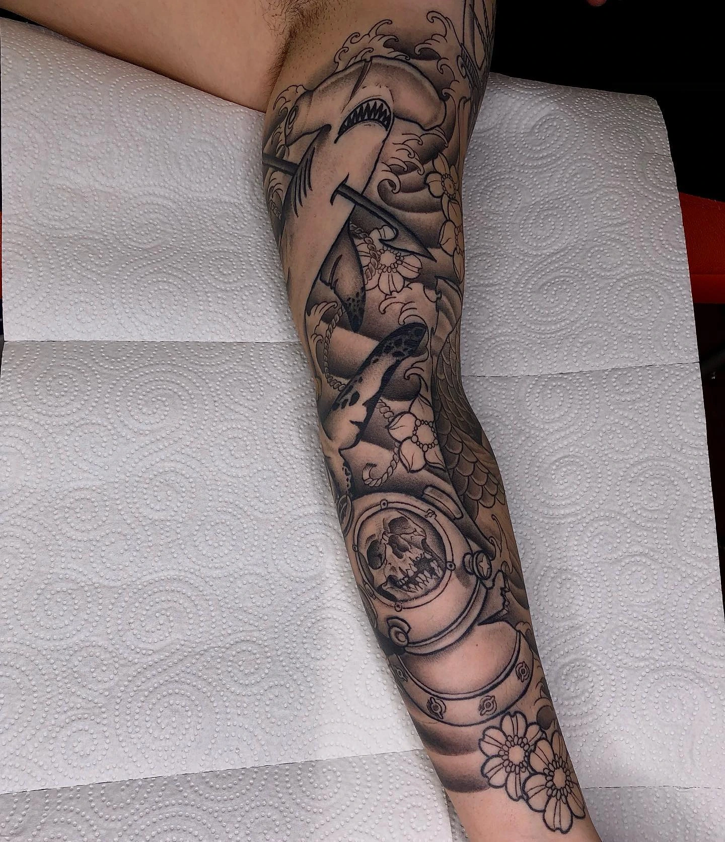 Japanese full sleeve: hammerhead shark, koi/serpent, diving helmet skull, cherry blossoms