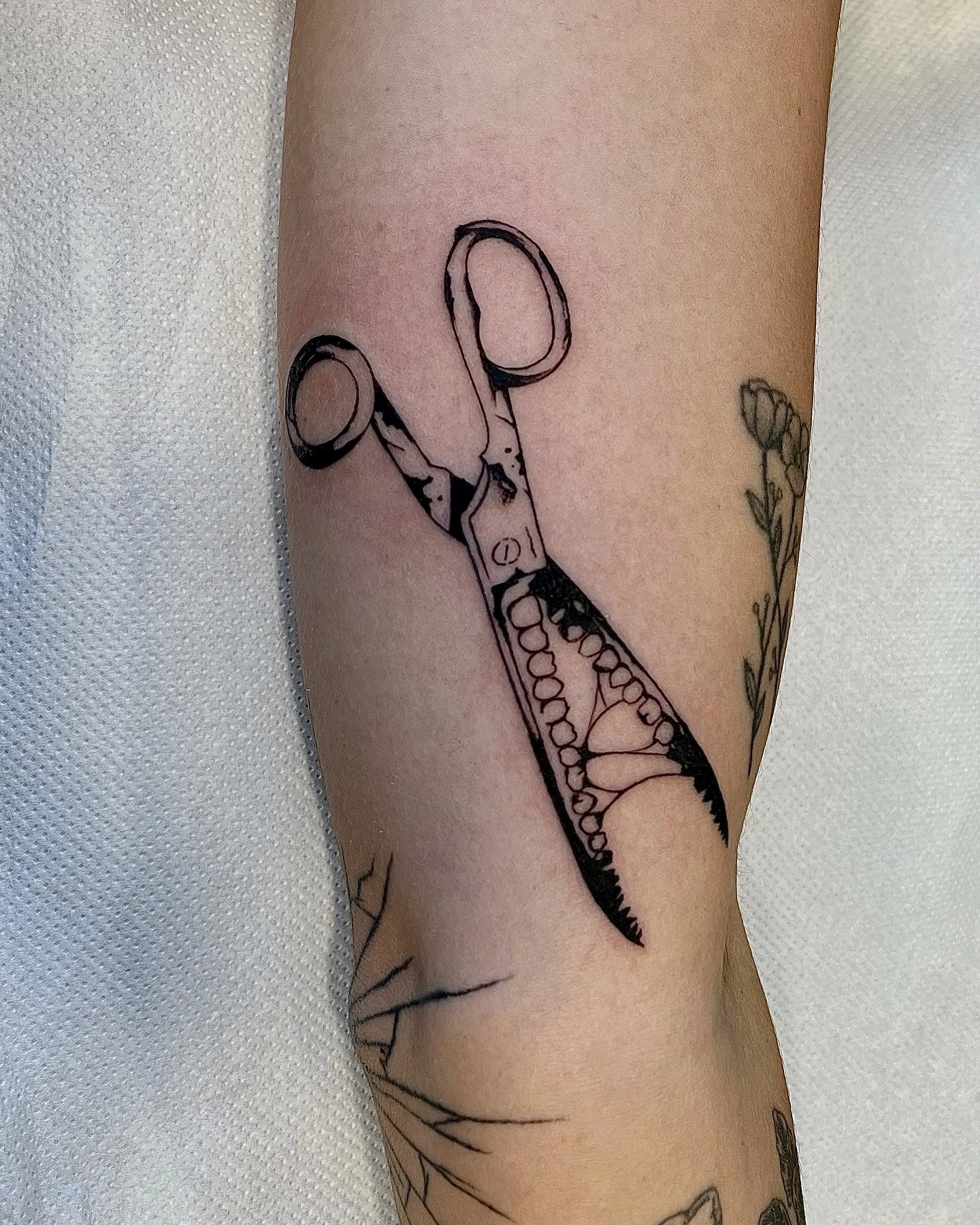 Vintage scissors with pearls dripping from blade