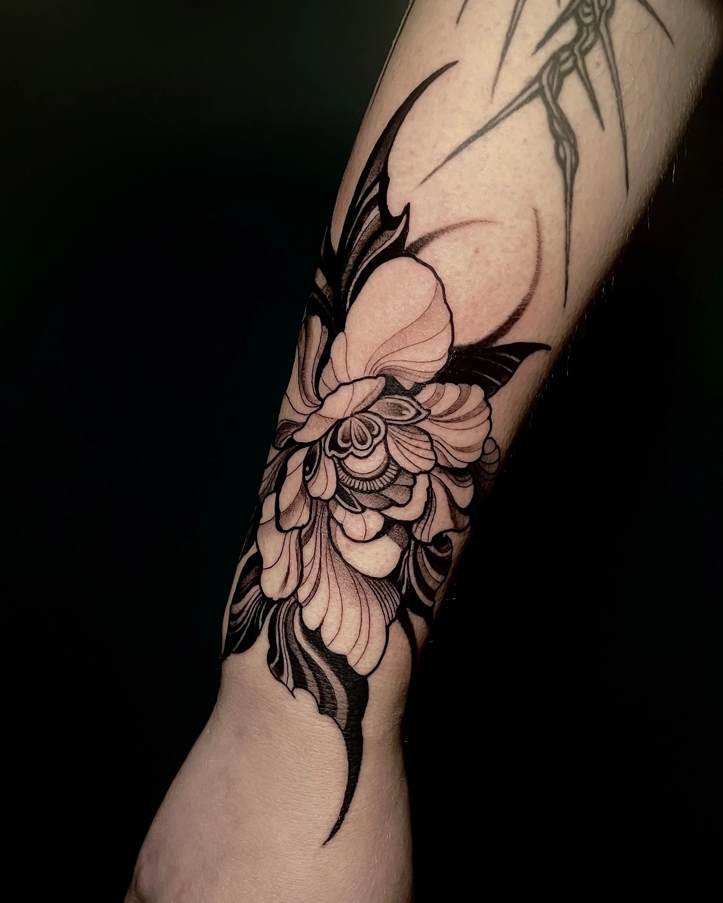 Dark peony with thorny tribal shapes — moody b&g