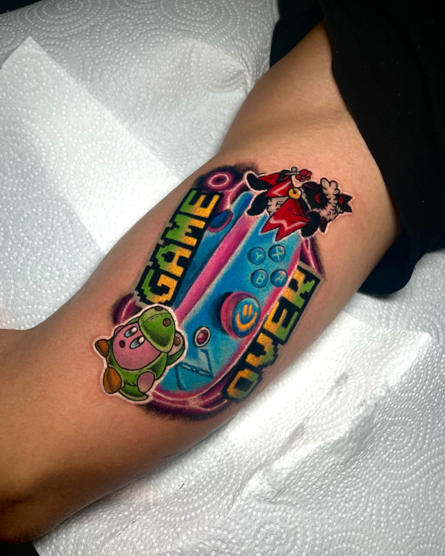 Game Over controller with Kirby and snowman characters in saturated color