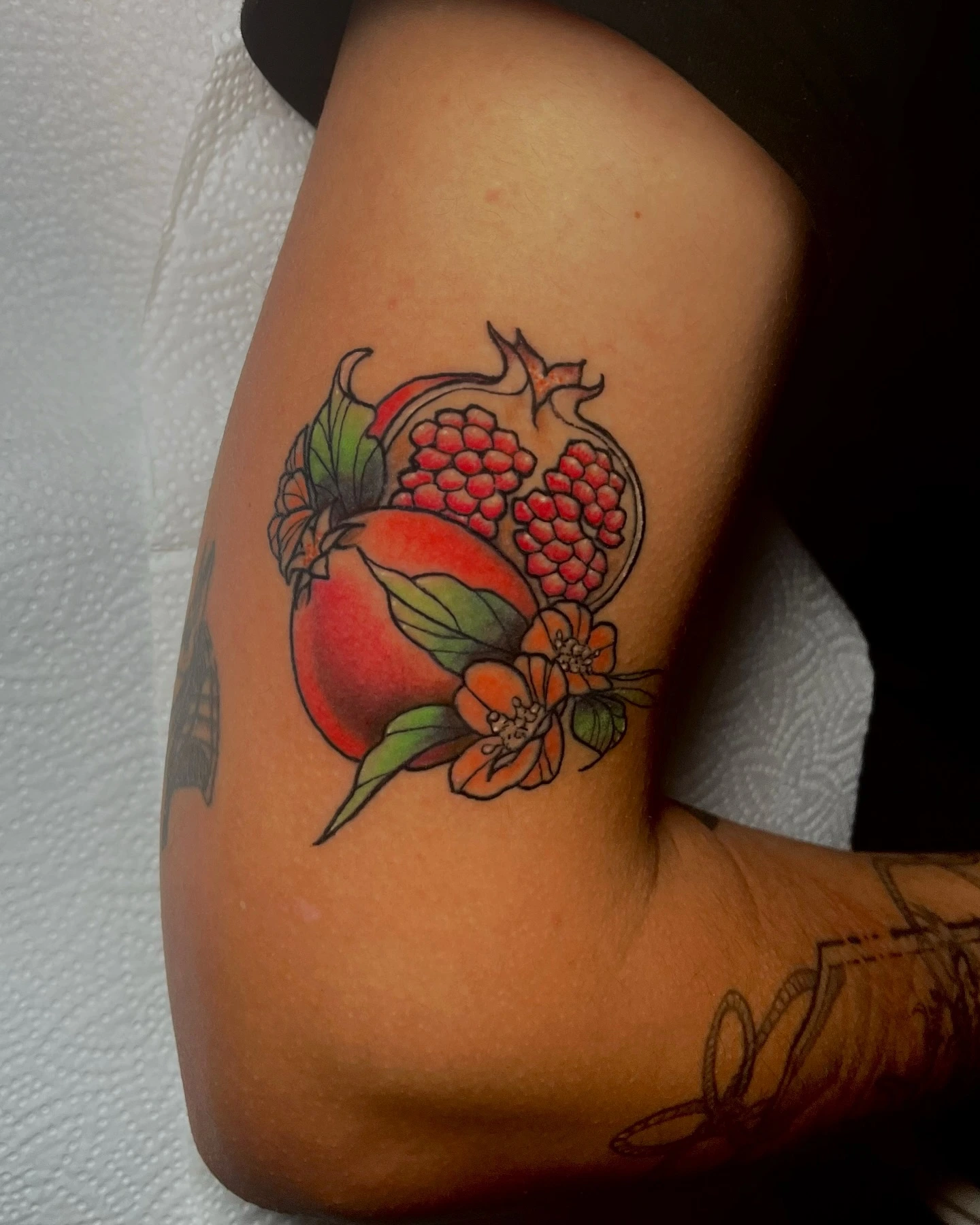 Pomegranates with leaves and orange blossom