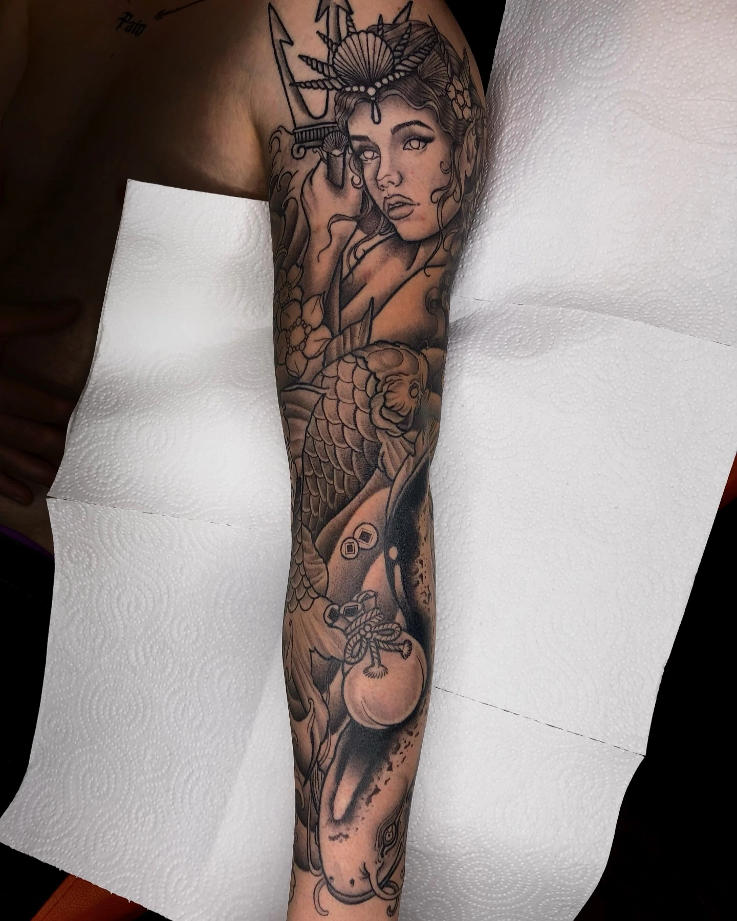 Healed full sleeve: geisha portrait, koi, money bag, trident, peony