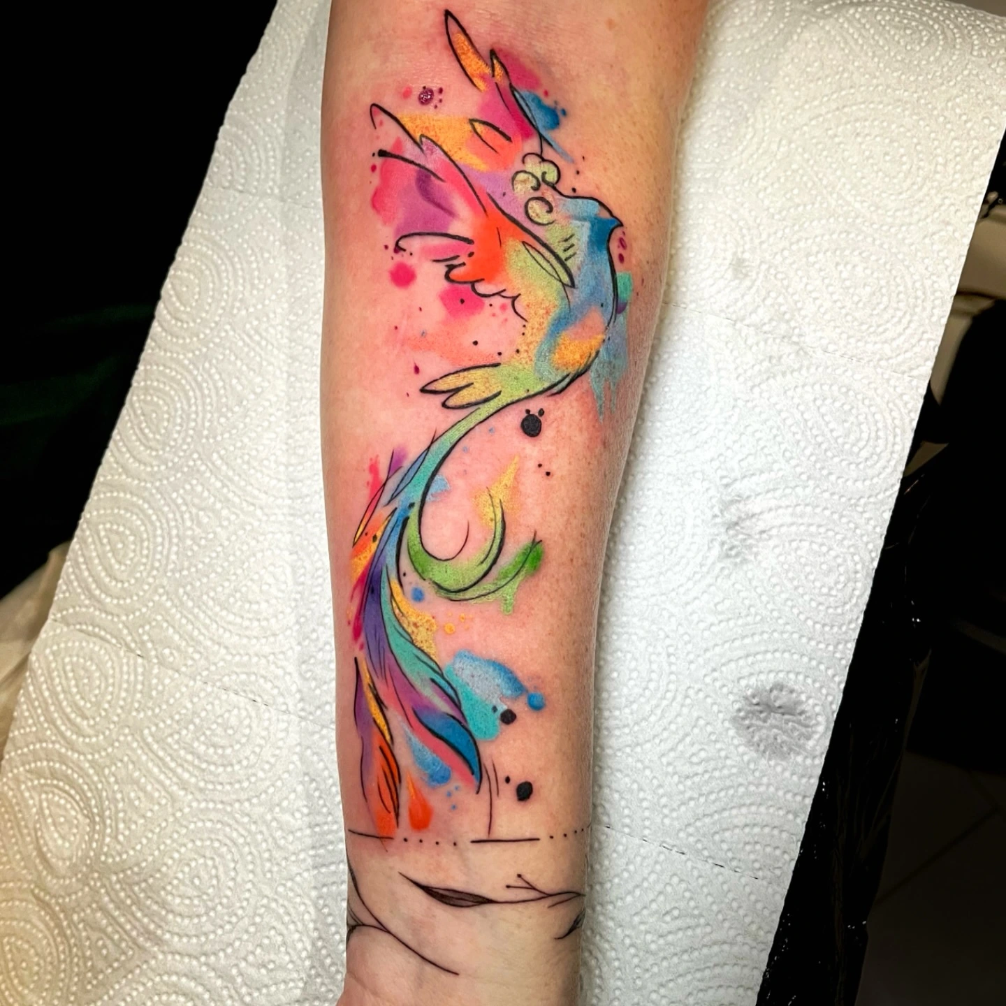 Phoenix in rainbow watercolor splatter