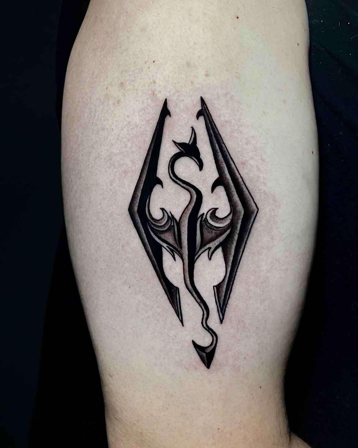 Skyrim dragon emblem in black & grey
