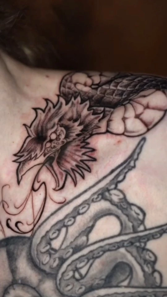 Pair of detailed dragon/serpent + lotus chest decorations