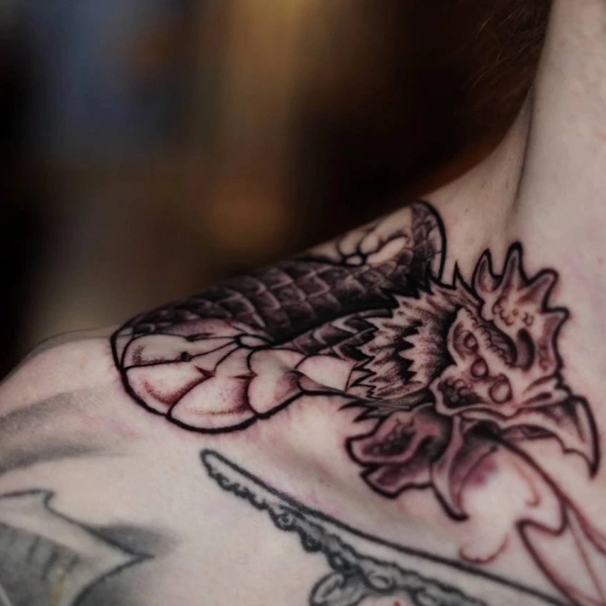 Oriental dragon-head/peacock detail near collarbone (in progress)