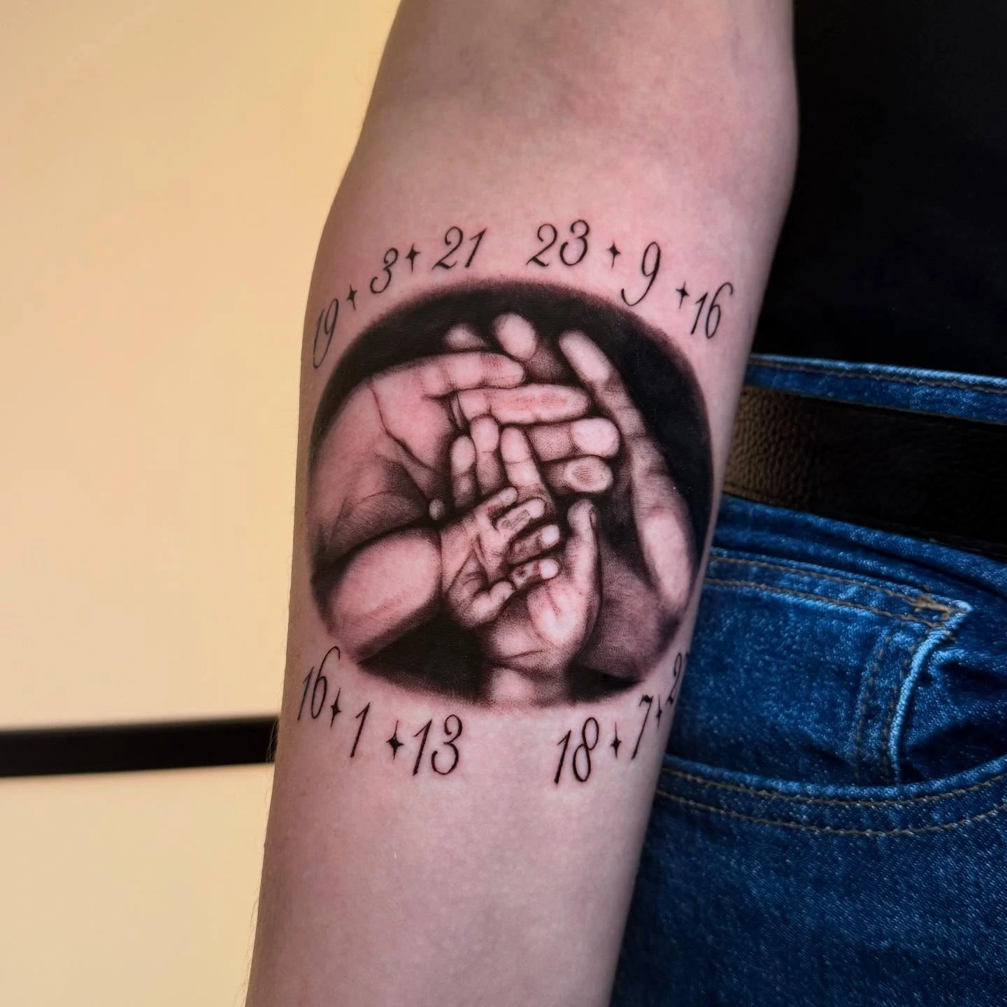 Photoreal baby/parent hands clasped + ornamental numerals border