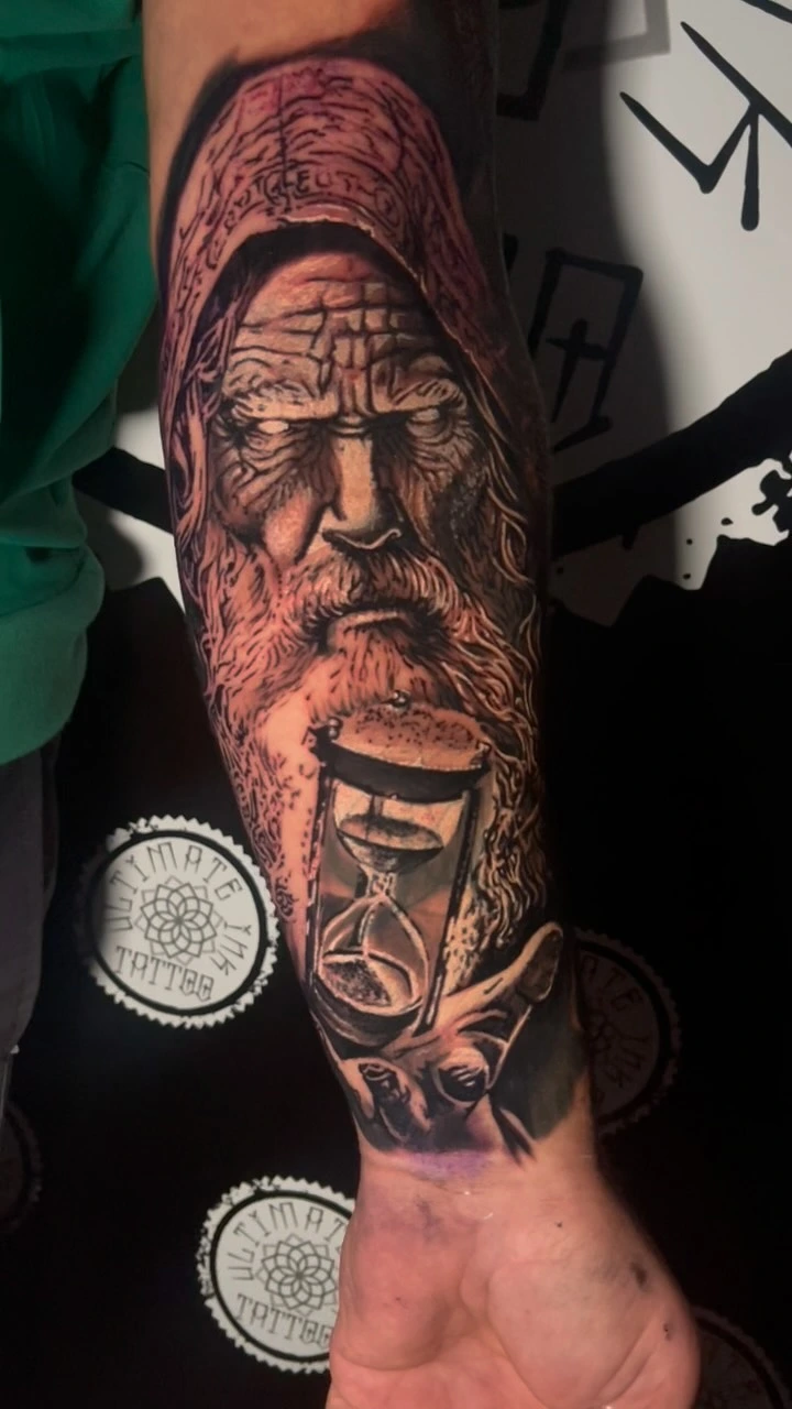Old hooded Norse/Odin-like figure with hourglass and skeletal hand