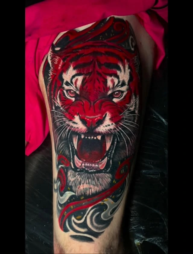 Roaring red tiger head with red/black tribal smoke