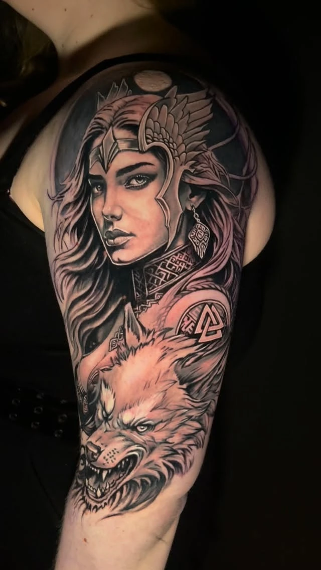 Valkyrie goddess with valknut + wolf companion