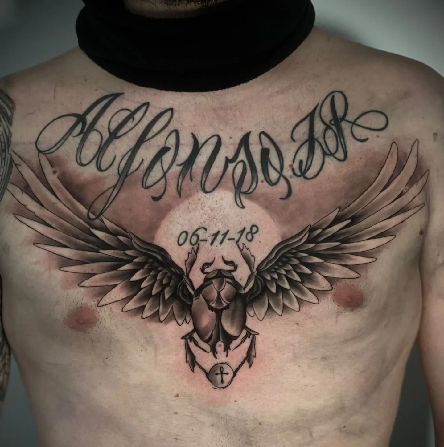 winged Egyptian scarab beetle with date '06-11-18' and 'Alfonso JR' calligraphy script