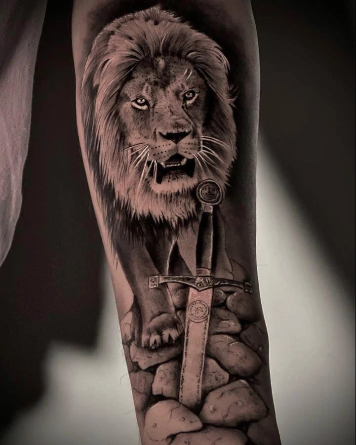 lion with crown and Excalibur sword embedded in stones